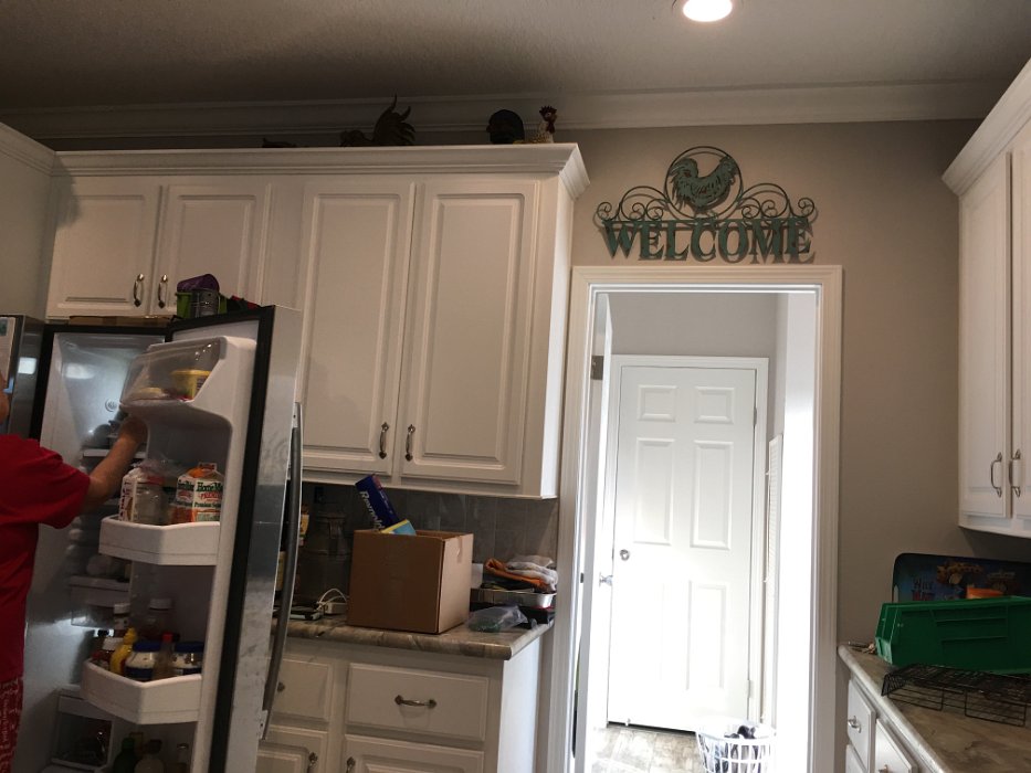 13-Looking thru laundry rm to master bath door from kitchen.jpg